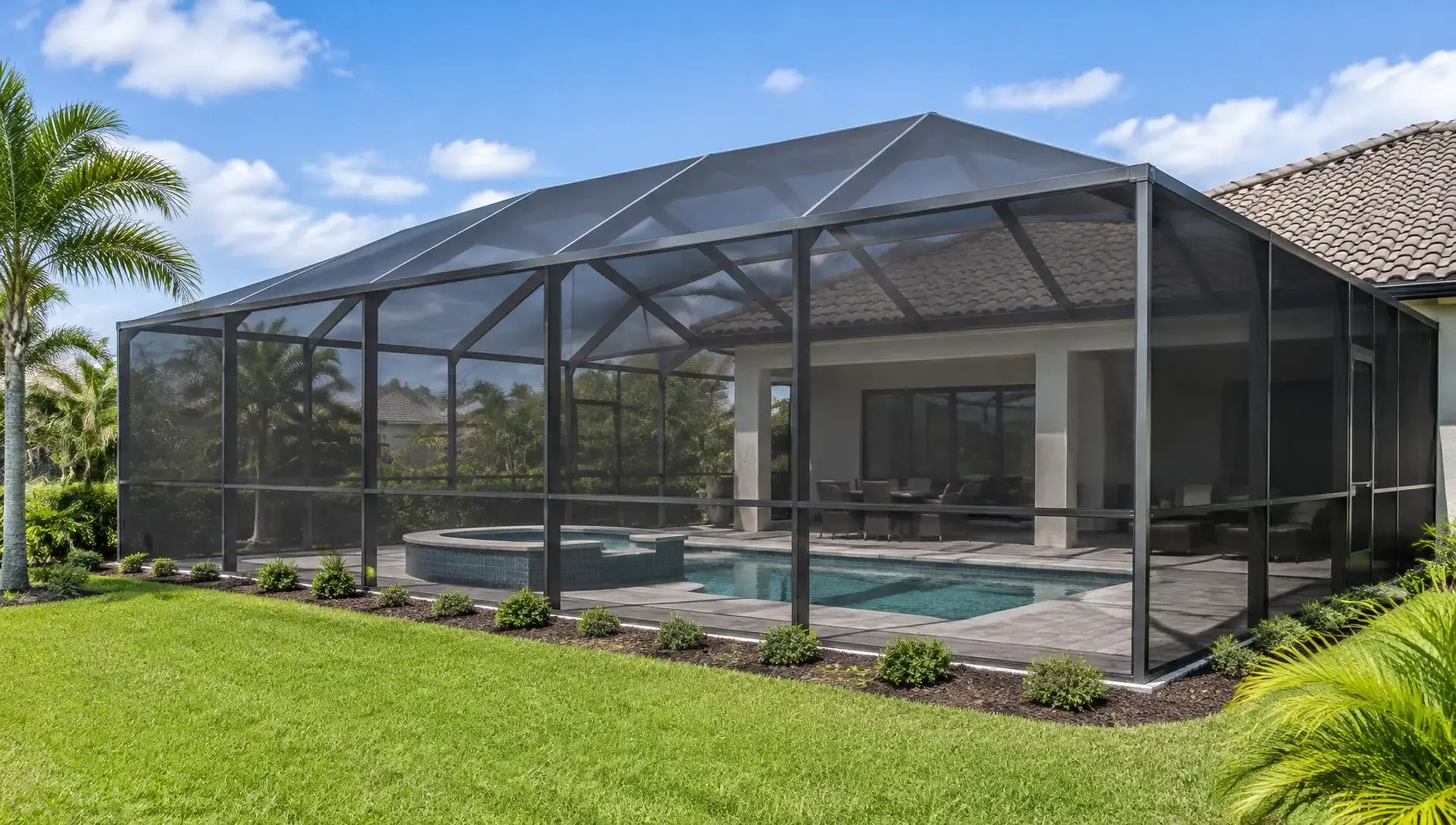 Large pool cage with uniform screen on every wall and roof panel